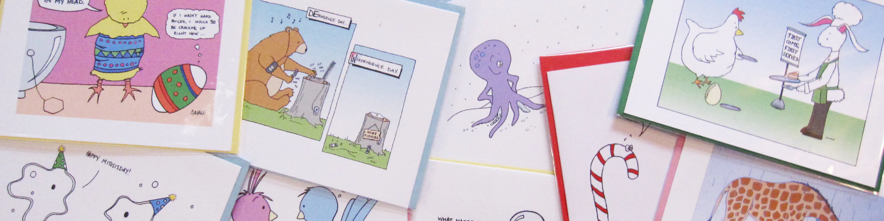Comic greeting cards spread on table